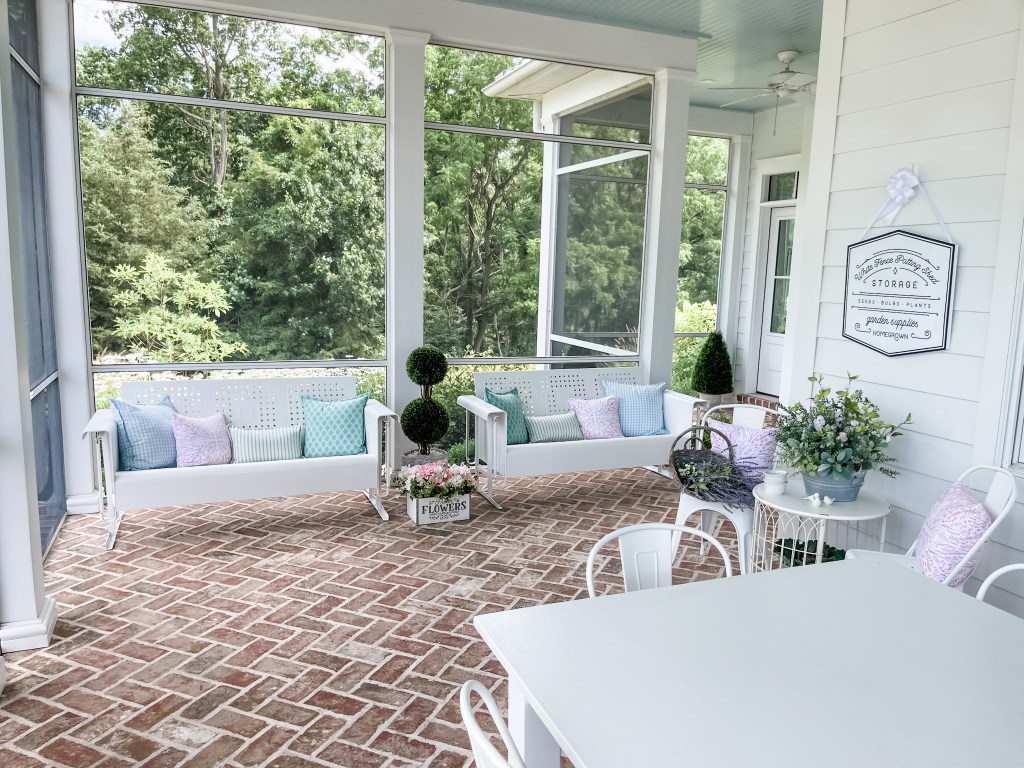 white retro gliders on the back porch
