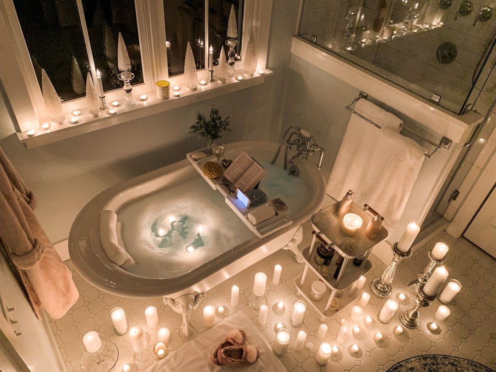 clawfoot bathtub with candles