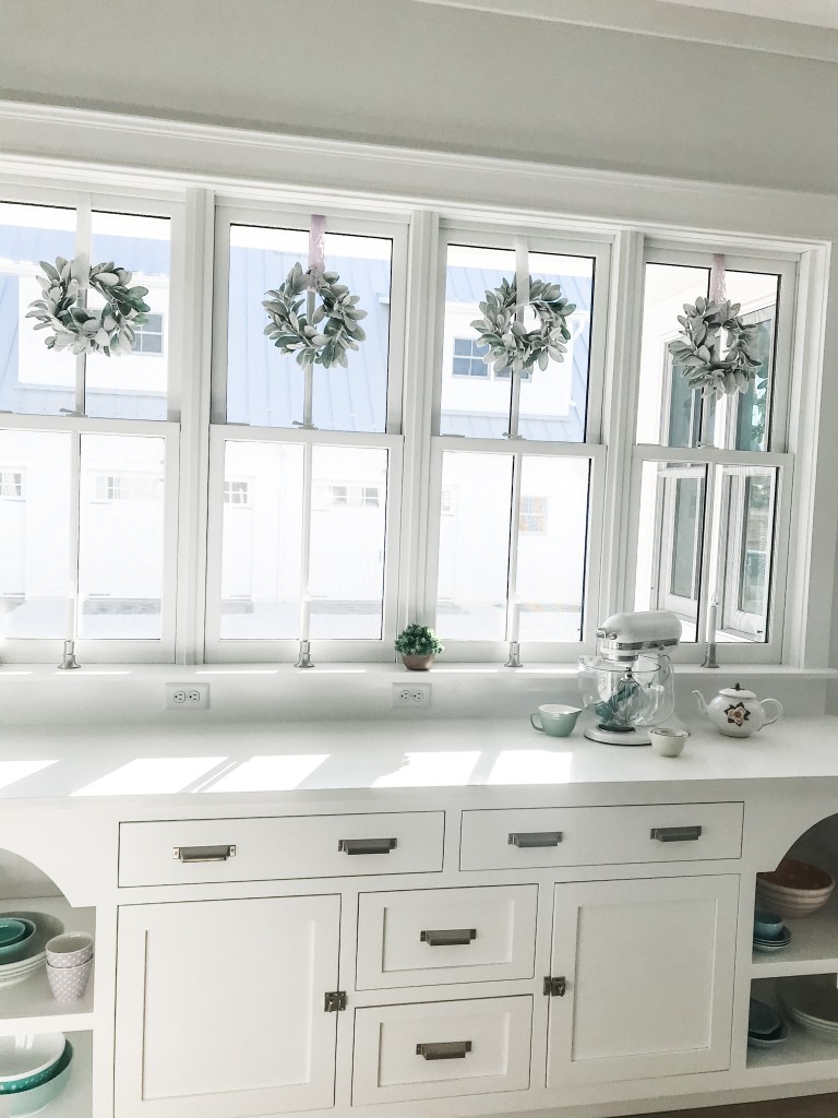 windows above kitchen cabinetry
