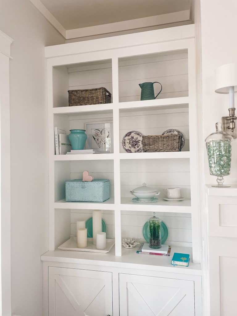 shiplap behind the bookshelf