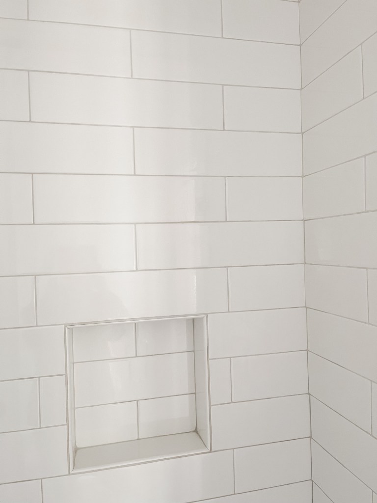 oversized white subway tile shower