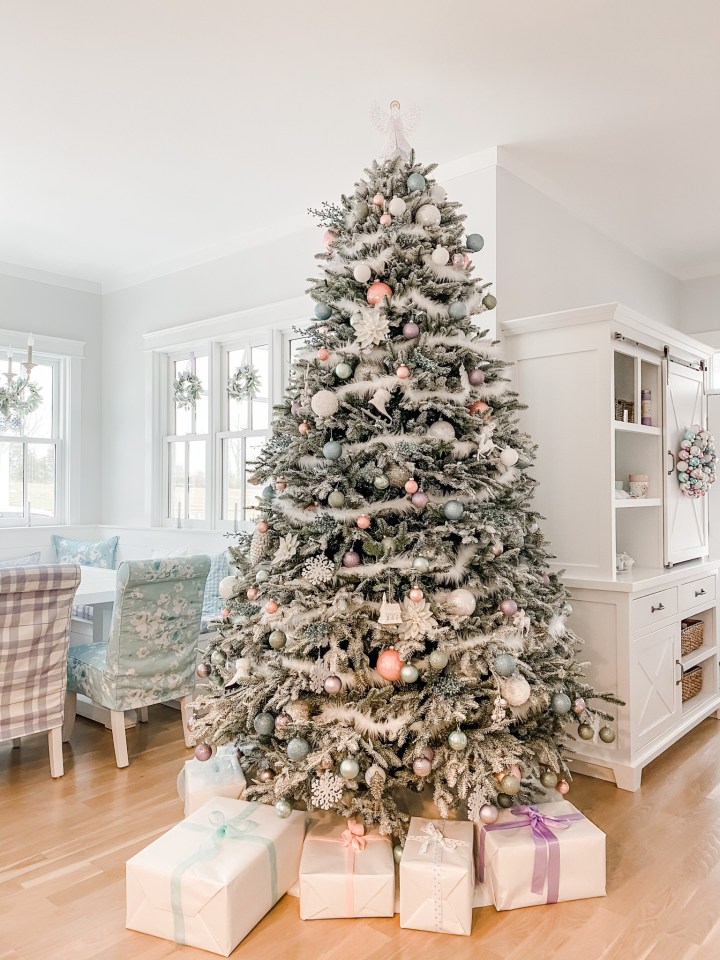 flocked Christmas tree with pink and blue ornaments