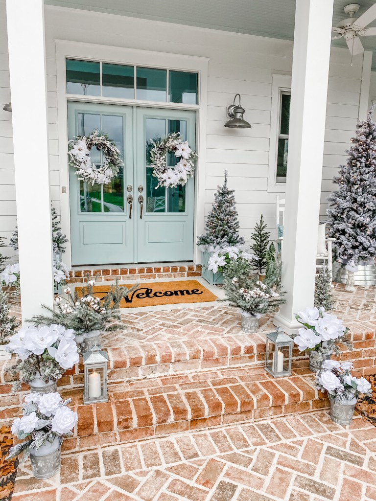 Front door and steps with Christmas decor