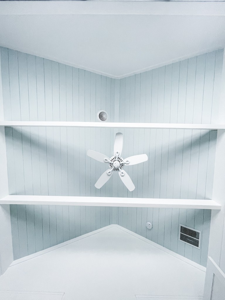 blue ceiling with white beams