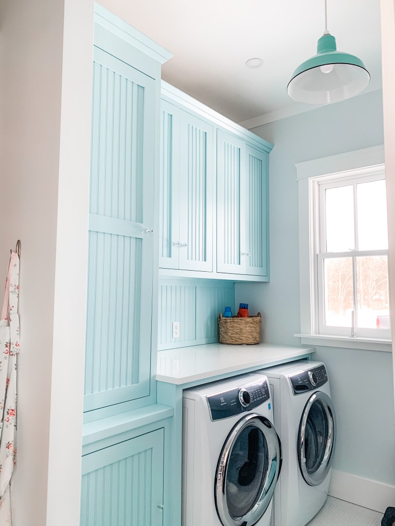 blue laundry room cabinetry