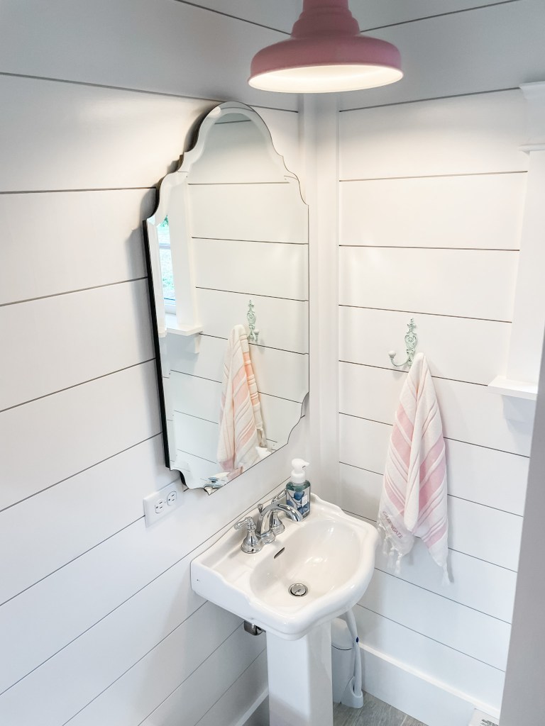 pool house bathroom mirror and sink
